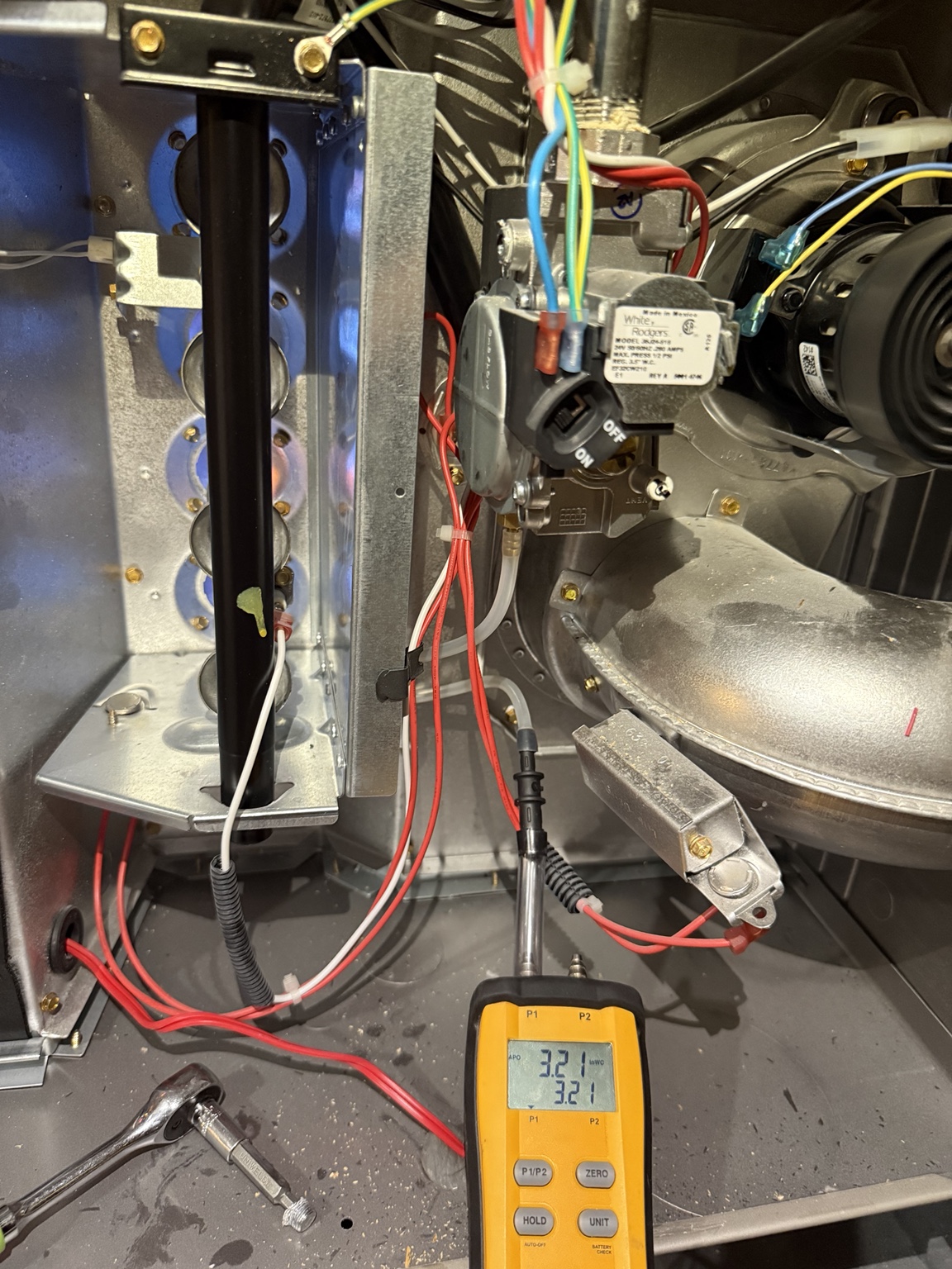 HVAC diagnostic testing inside furnace cabinet